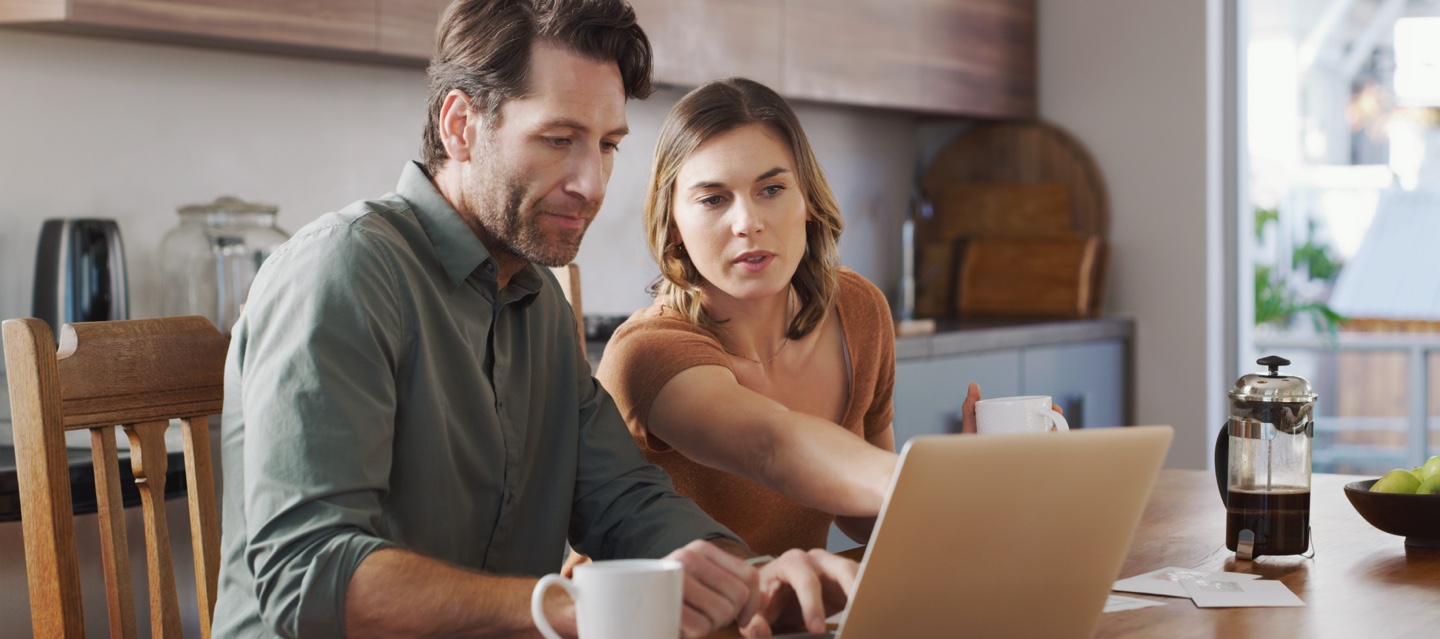 Couple looking at laptop